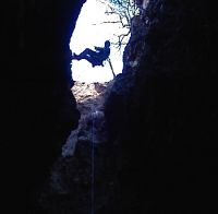 View from the bottom of Crystal Cave, of person abseiling