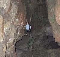 Person abseiling into Crystal Cave